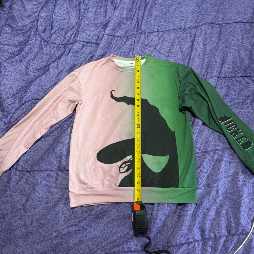 Kids WICKED Long Sleeve (look at tape measure for sizing) as shown on photo